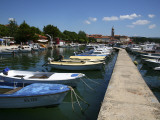 Boats in Harbour Beside Obala Hrvatske Mornarice Promenade with Tower of Krk Cathedral Beyond