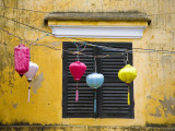 Lanterns Hanging Besides Bright Yellow Wall