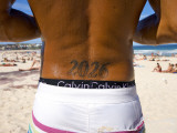 Man with Bondi Post Code Tattooed on His Back Standing on Bondi Beach