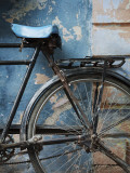 Bicycle Leaning Against Painted Wall