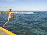 Girl Jumping into Sea at Clovelly Bay