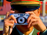 Guard Using His Camera on China's National Day in Tianamen Square 