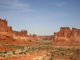 Cars Travelling Towards Rock Formations Including Three Gossips and Courthouse Towers