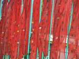 Red Prayer Flags on Green Flagpoles at Pemayangtse Monastery