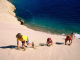 Overhead of Children Climbing Sand Dune