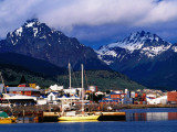 Yachts Docked on Waterfront  City and Mountains