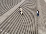 People on Steps of National Bibliotheque (Library) in Gare De Lyon