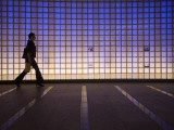 Pedestrian in a Neon-Lit Passageway in Namba Station