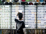 Customer at Sunglass Stall at Kata Beach Evening Market