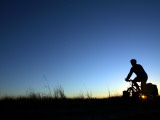 Man Cycle Touring at Dawn
