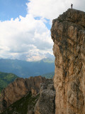 Hiker Standing on Top of Cliff Near Averau Peak in Dolomites Range Near Cortina