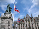 Statue of Jan Breydel and Pieter De Coninck with Provincial Palace in Market Square