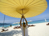Man Putting Up Umbrella on Kamala Beach