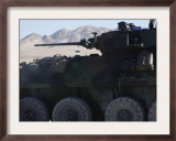 A Light Armored Vehicle Fires its 25Mm Bushmaster Chain Gun