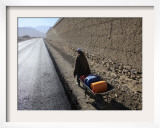Child Uses a Wheel Barrow to Carry Jugs of Water  Logar Province  Afghanistan