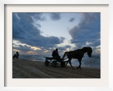 Palestinians Ride on Horse-Drawn Carts Along the Beach South of Gaza City