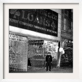 A Policeman Stands in Front of a Pawn Shop