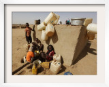 Refugee Children Wait their Turn to Collect Water Supplies at a Water Station in Sudan