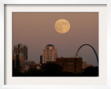 A Full Moon Rises Behind Downtown Saint Louis Buildings and the Gateway Arch Friday