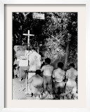 A Catholic Priest Celebrates Mass at the Open Air Chapel of Lourdes