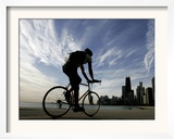 A Lone Cyclists Pedals Along Lake Michigan