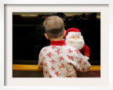 Six-Year-Old Boy Looks out the Window for Santa Claus