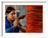 A Woman Offers Prayers to a Banyan Tree Covered by Sacred Thread