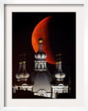 Moon is Seen Rising in the Sky Above the Domes of the Smolny Cathedral in StPetersburg  Russia