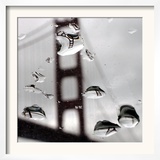 Rain Drops are Shown on a Car Windshield with the Golden Gate Bridge in Background