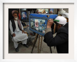 Afghan Street Photographer Takes a Portrait of a Customer with a Wooden Made Camera