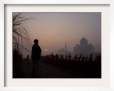 Farmer Looks at the Sunrise from His Field  with the Taj Mahal in Agra in the Background  India