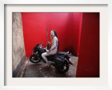 Ash Smeared Naked Hindu Holy Man  Poses on a Motorcycle at the Kumbh Mela Festival in India