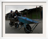 Children Push a Wheelbarrow as They Return Home in the Outskirts of Kabul  Afghanistan