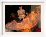 A Woman Prepares to Burn Hell Money