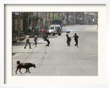 Children Play Soccer on a Deserted Street of Katmandu  Nepal