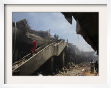 Indonesian Rescue Workers Walk on a Eartquake Damaged Building  in Padang  Indonesia