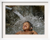 Girl Bathes in a Pond at the India Gate Monument Lawns in New Delhi  India