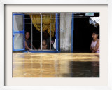 Family Look Out from House Where are Suffering from Flooding in Pungo Village  Northern Philippines