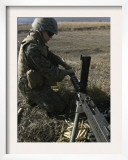 A Soldier Changes the Barrel of an M2 50 Caliber Machine Gun