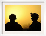 US Army Soldiers Silhouetted Against the Morning Sun in Afghanistan
