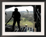Airman Watches a Practice Bundle Fall from a C-17 Globemaster Iii