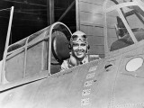 Smiling WWII Navy Pilot Sitting in Cockpit