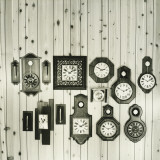 Display of Clocks Collection on Pine Wall