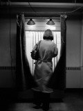 Woman Casting Ballot in Voting Booth  Rear View