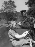 Motorcycle Cop Writing Ticket For Woman Driver in a Convertible Car