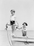 Boy Standing on Bow of Row Boat Holding Anchor  Girl Holding Rope