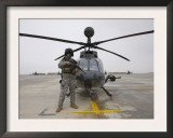 An Oh-58D Kiowa Warrior Pilot Stands Beside His Aircraft