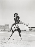 Couple Playing Leapfrog on Beach  Woman Jumping Over Man
