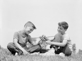 Boys Playing With Toy Plane
