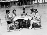 Group of People Sitting Poolside at Hotel  Eating Dinner  Miami  Florida